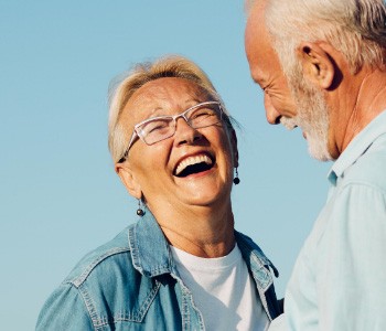 older woman smiling with her husband